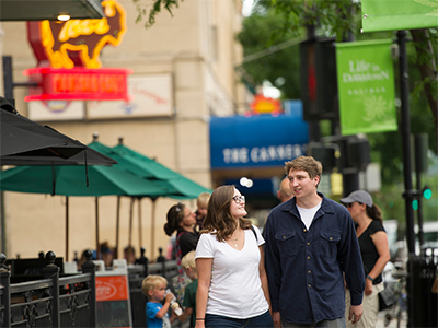 Two students walk downtown.