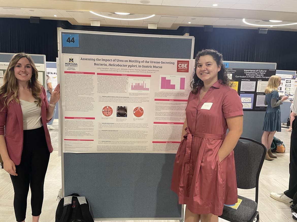 Katrina and Lydia standing at Lydia's research poster