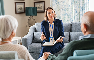 older couple talking on blue couch