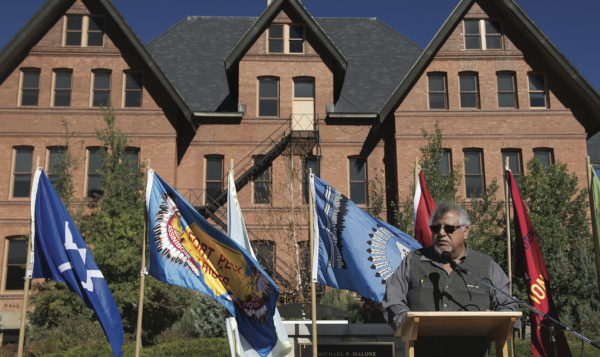 Walter Fleming with Tribal Flags at Montana Hall