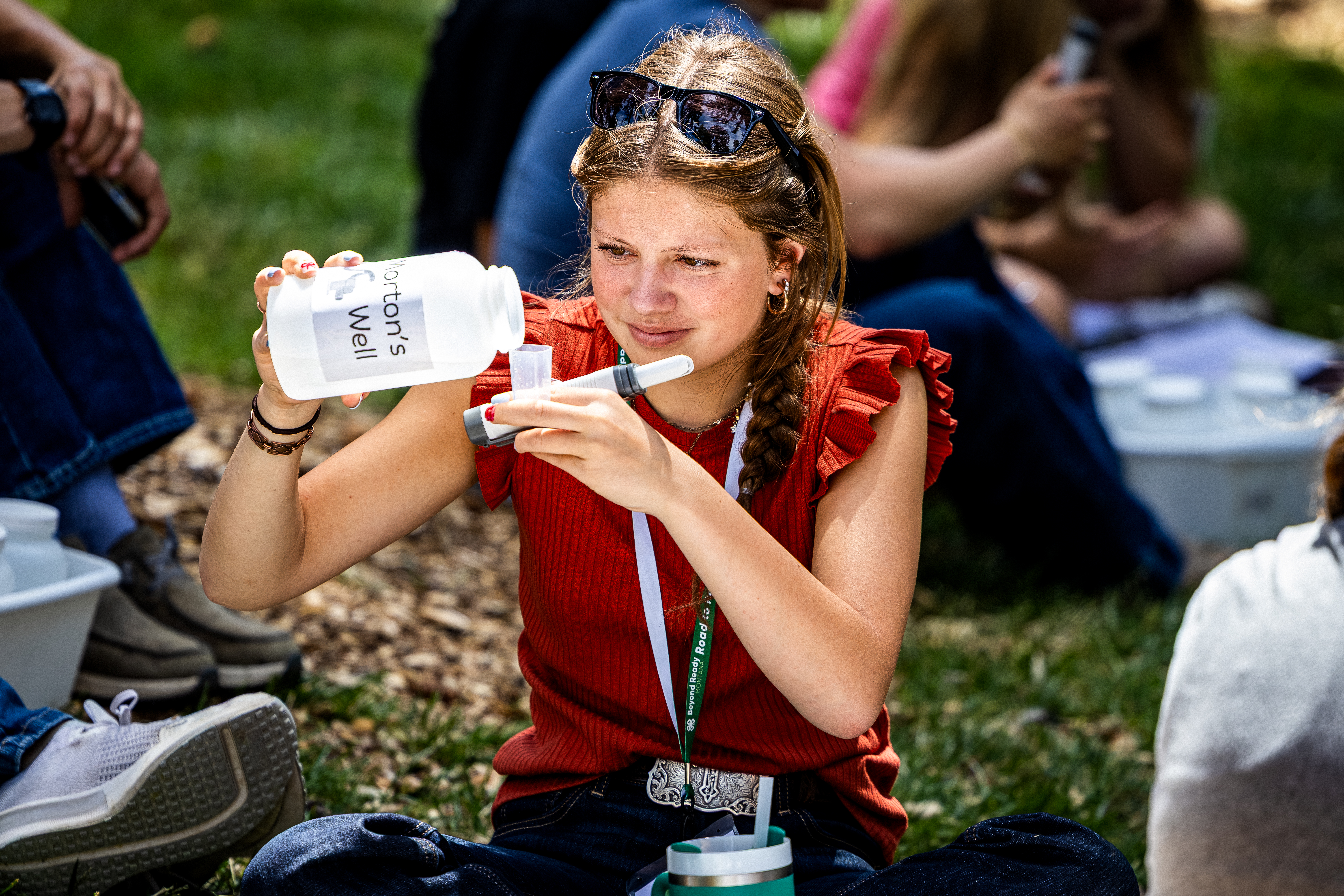 Girl filling test tube