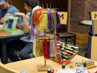 Colorful fly-fishing materials on a table