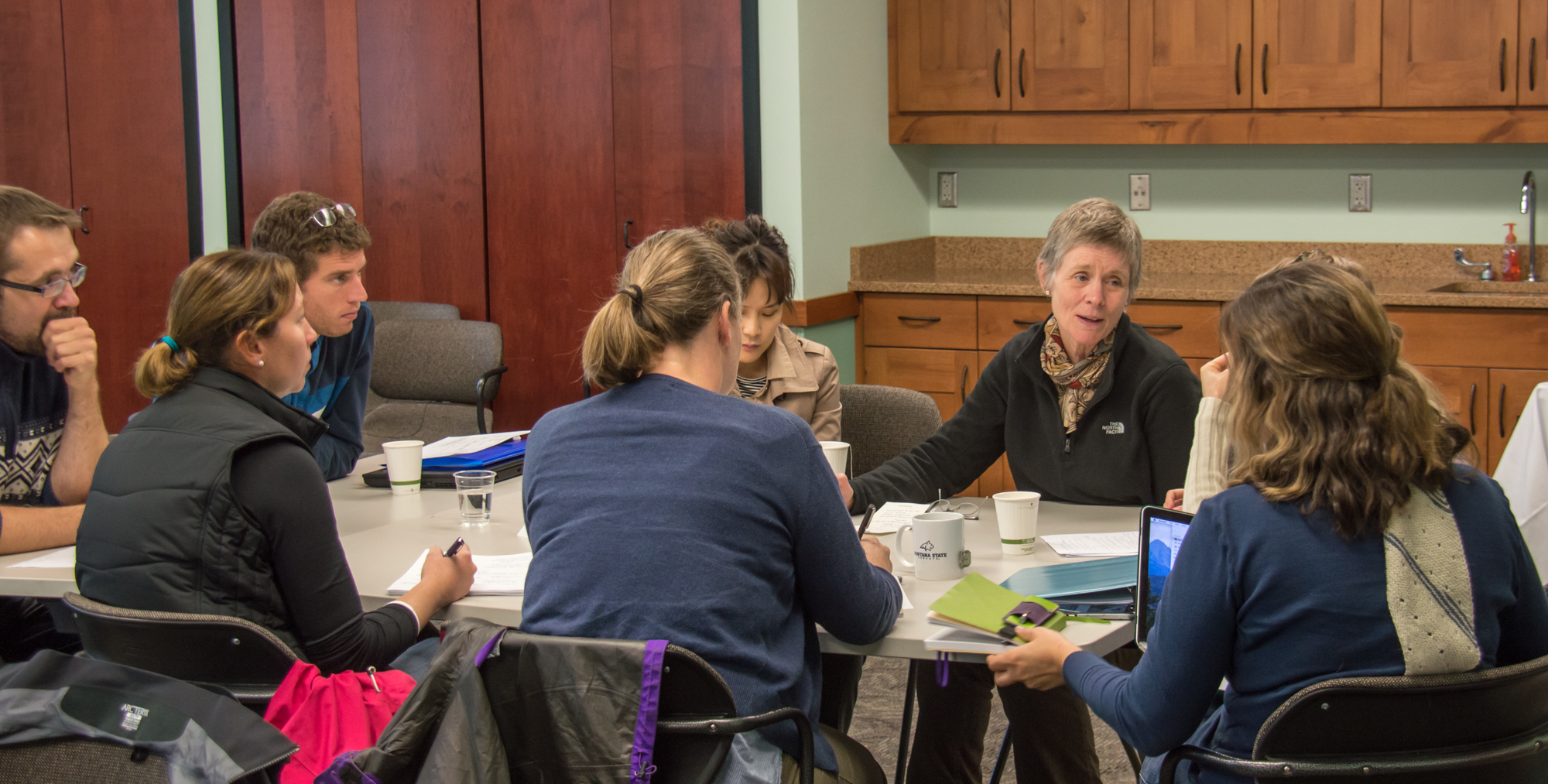 Group discussing writing