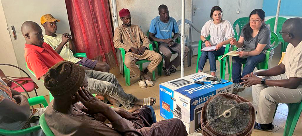 Senegalese men sit in a discussion group with MSU researchers