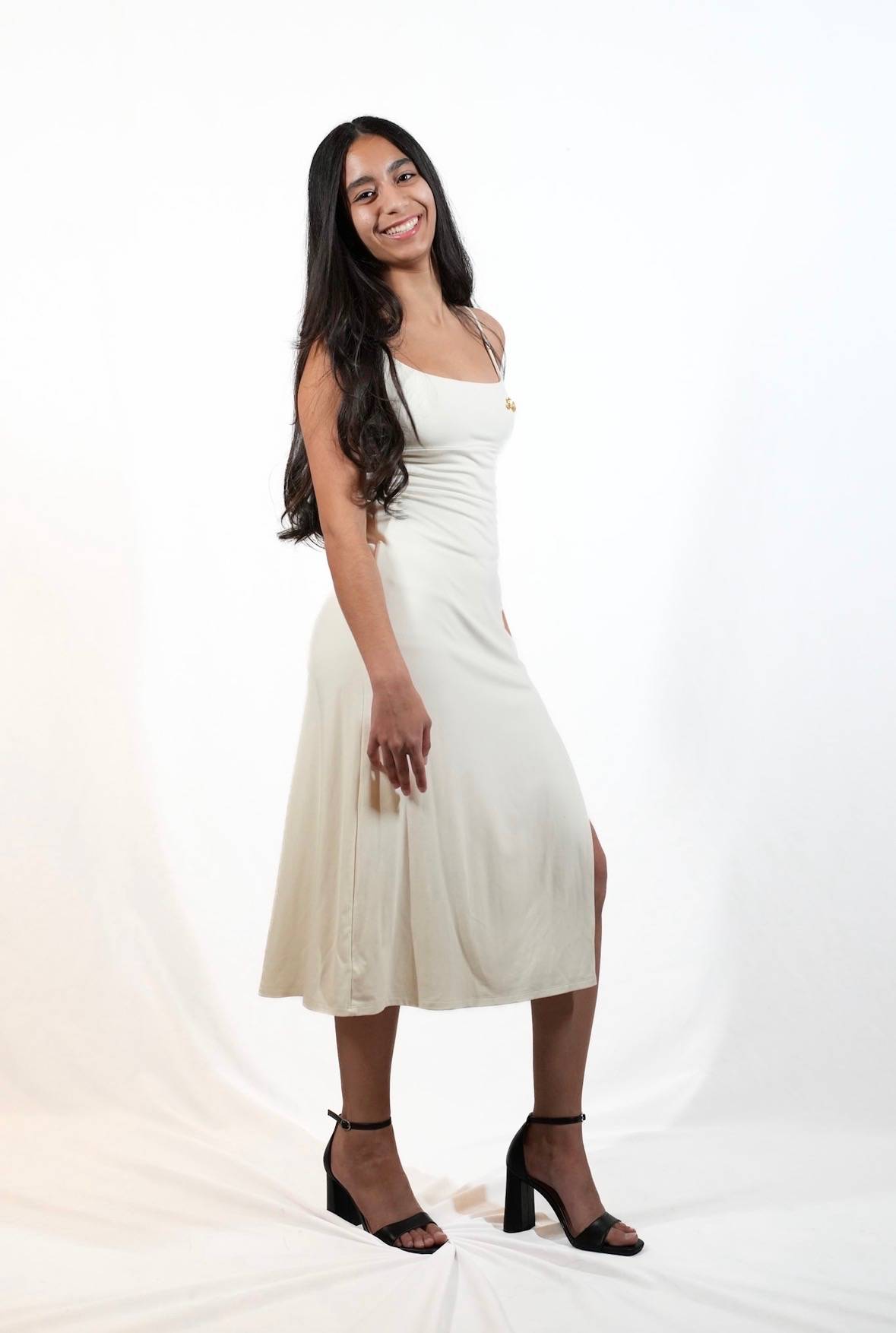 Female student wearing cream dress
