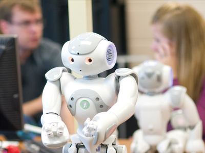 Two researchers with a robot.