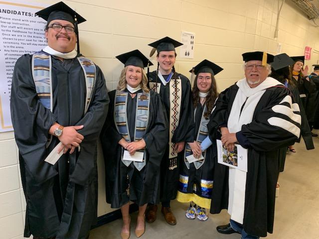 Spring 2024 graduates with Dr. Fleming