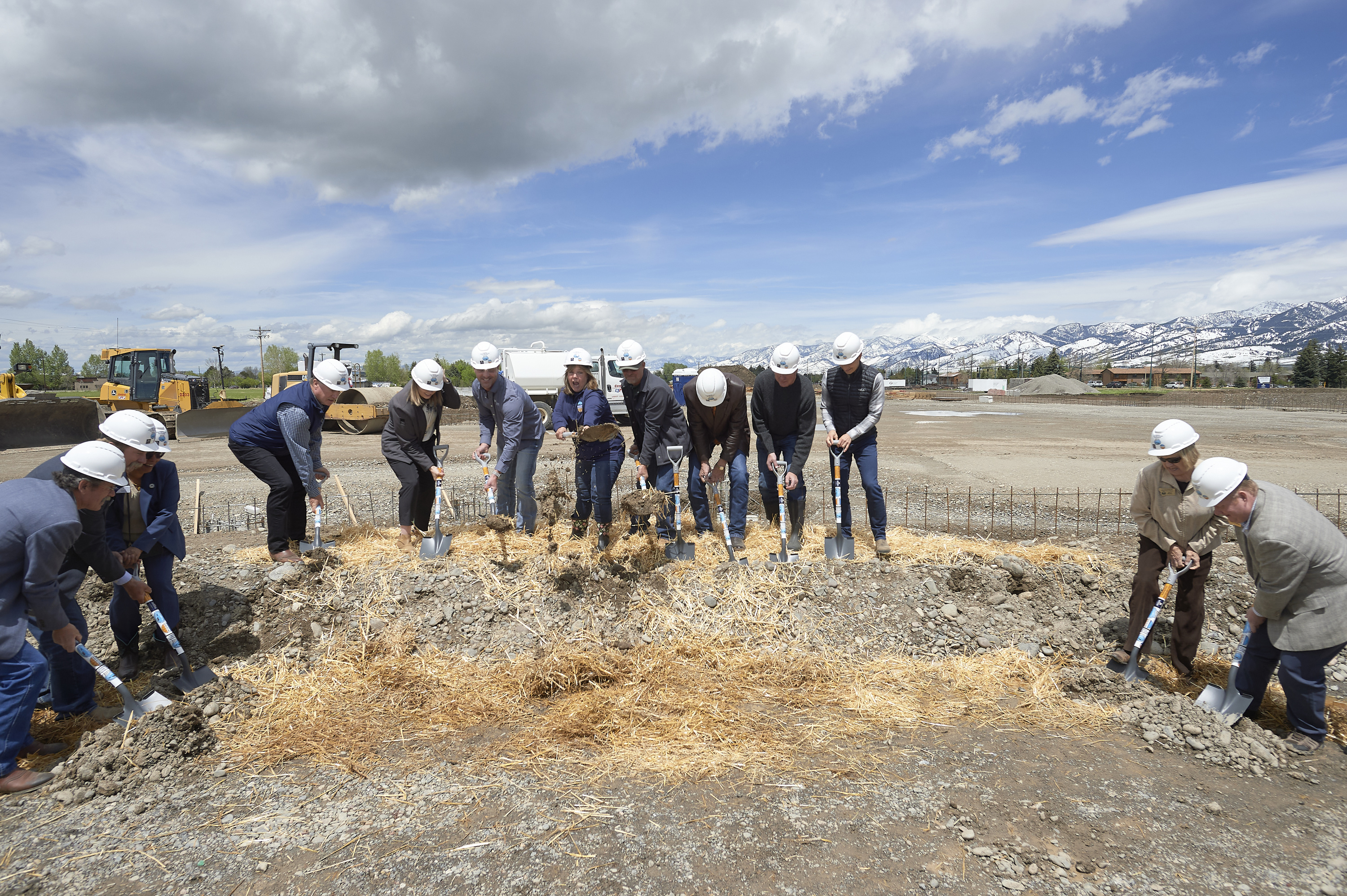 people with shovels and hardhats