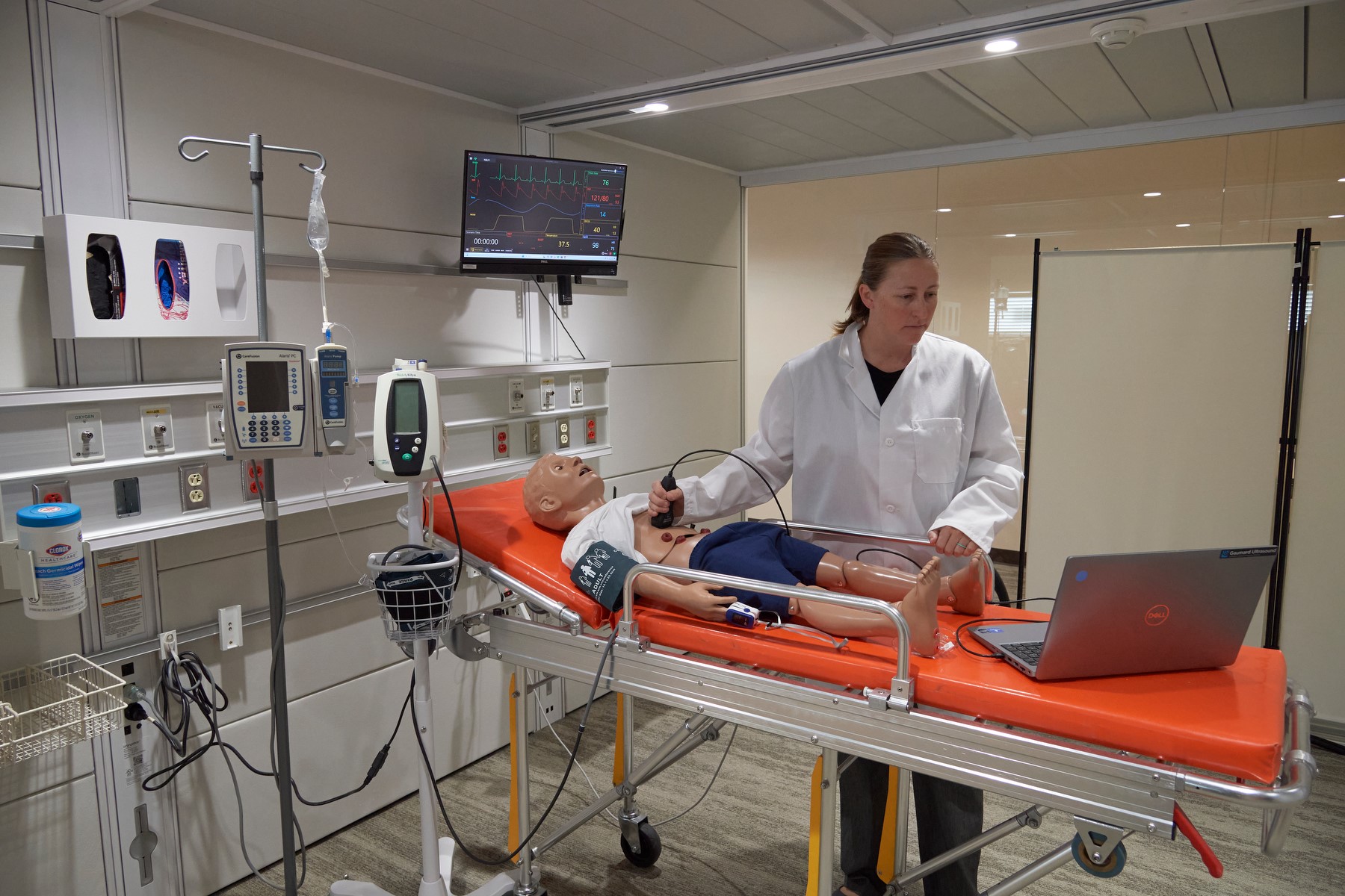 woman with mannequin and equipment