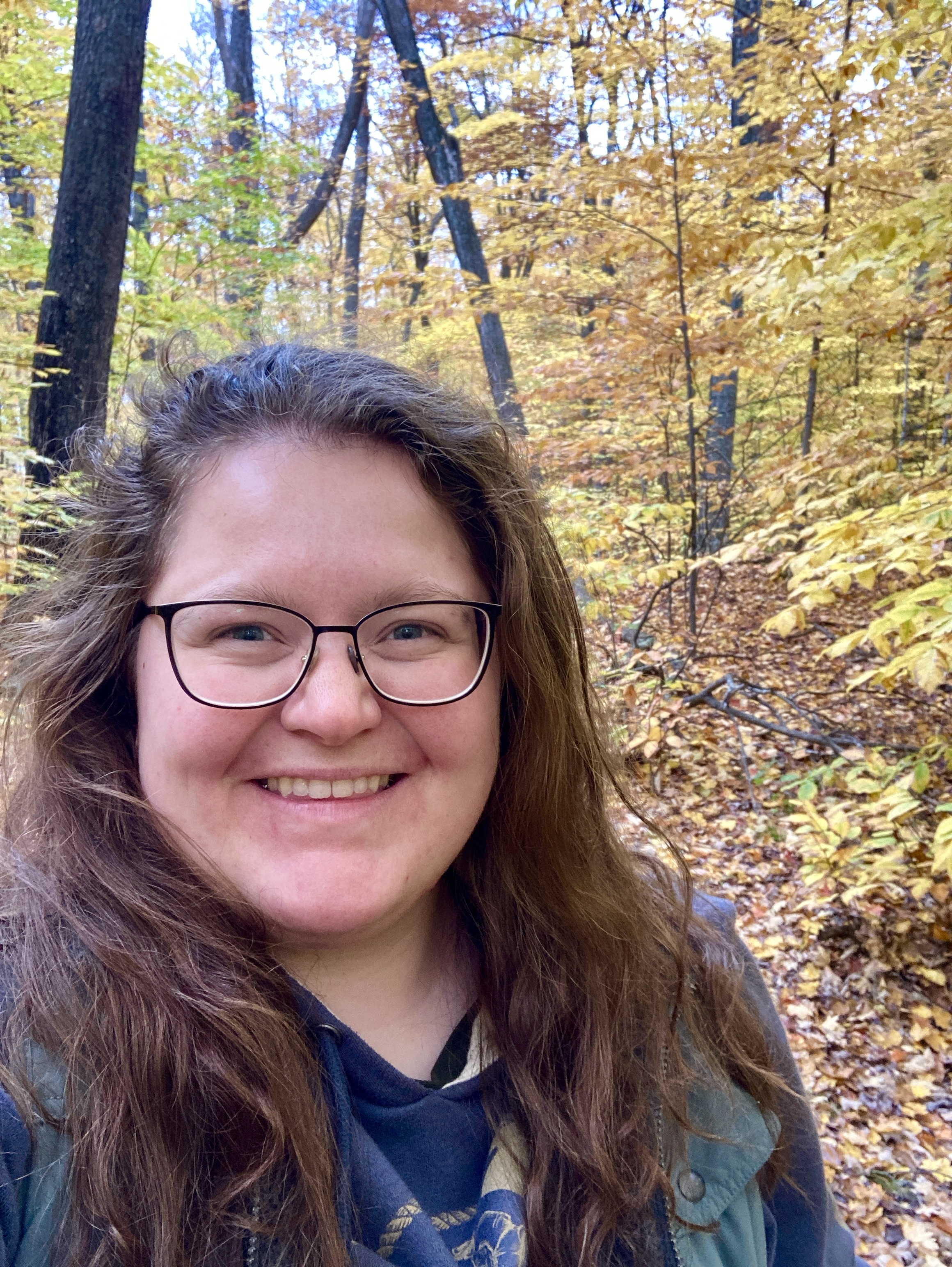 picture of Haley surrounded by fall foliage